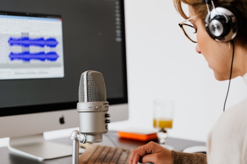 Person Using Microphone choosing studio furniture article featured image