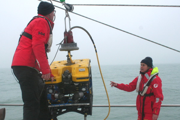 Sea Rangers prepare an ROV underwater camera to be launched