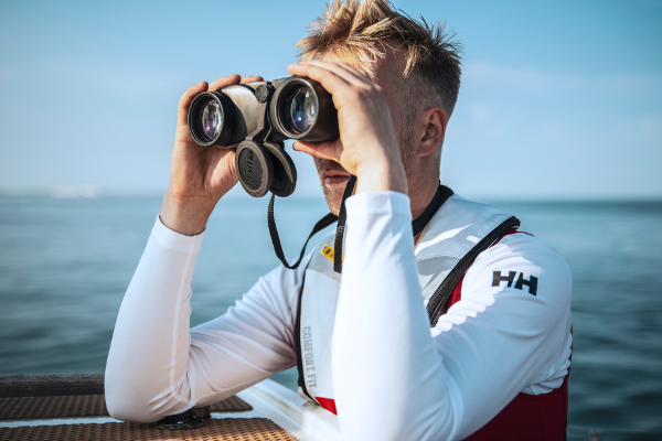 Sea Ranger looking through binoculars