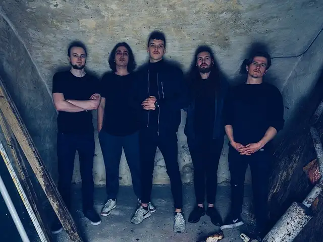 Monosphere (Picture of the band standing in front of a concrete wall)