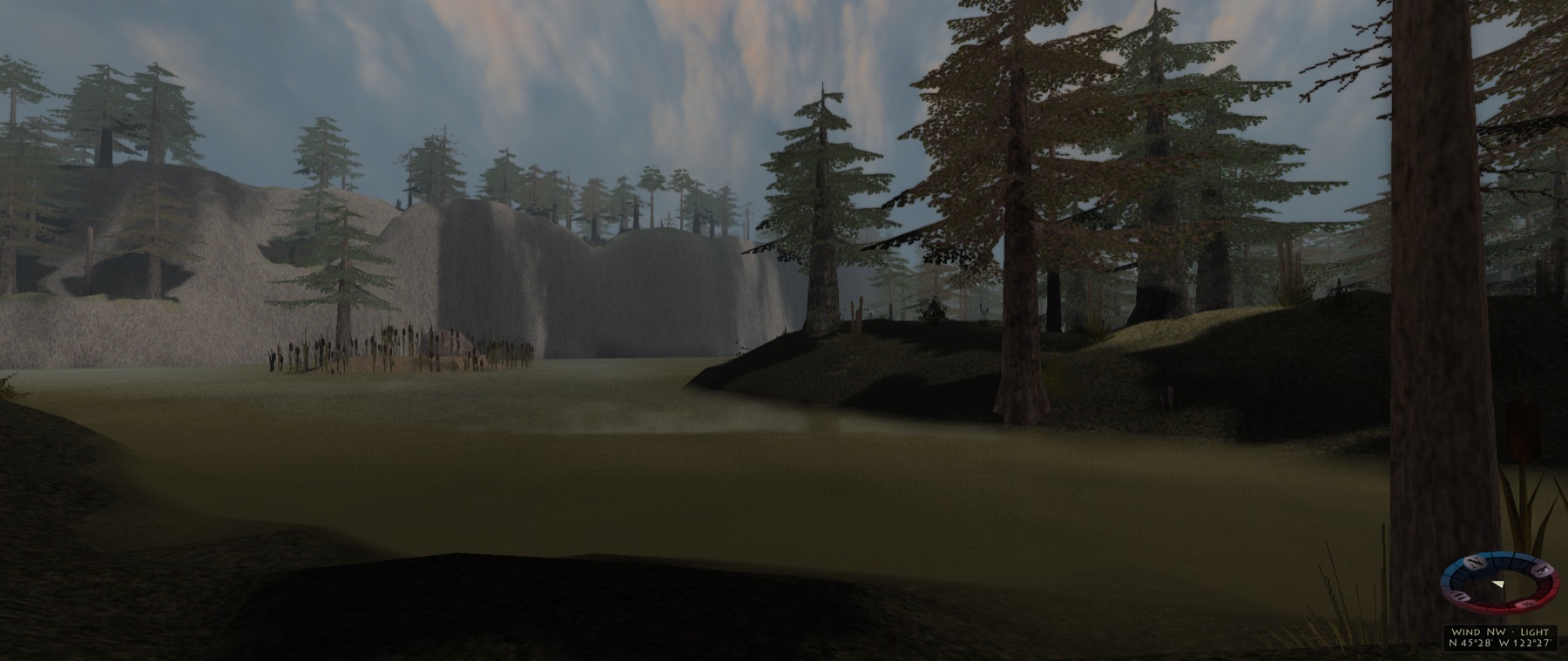 Still water below cliffs at dusk