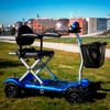 Scooter Eléctrico Plegable Cuatro Ruedas Con Cesta Portaobjetos