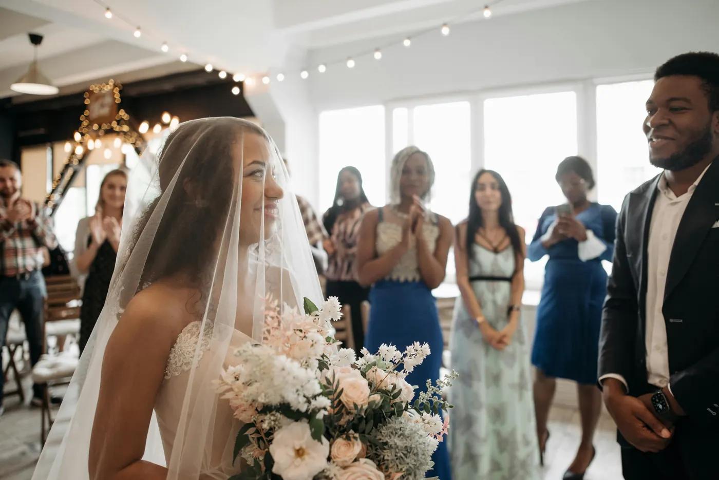 Bride and groom smiling together during their ceremony