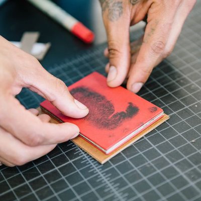 A close-up view of a tiny red book