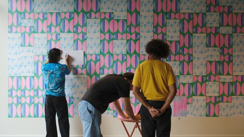 Juan Pablo, Troy, and Negash installing Windows to Other Worlds, 2024