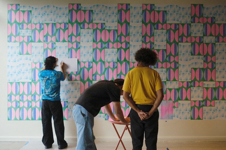 Juan Pablo, Troy, and Negash installing Windows to Other Worlds, 2024