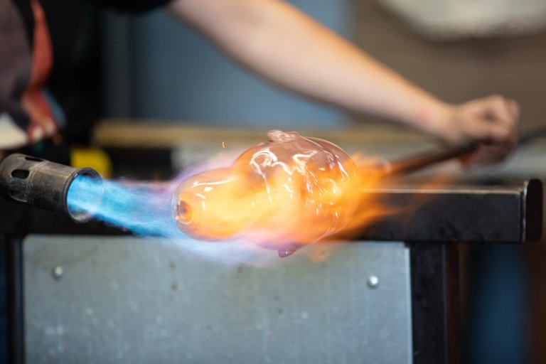 glass head being fired in a kiln room