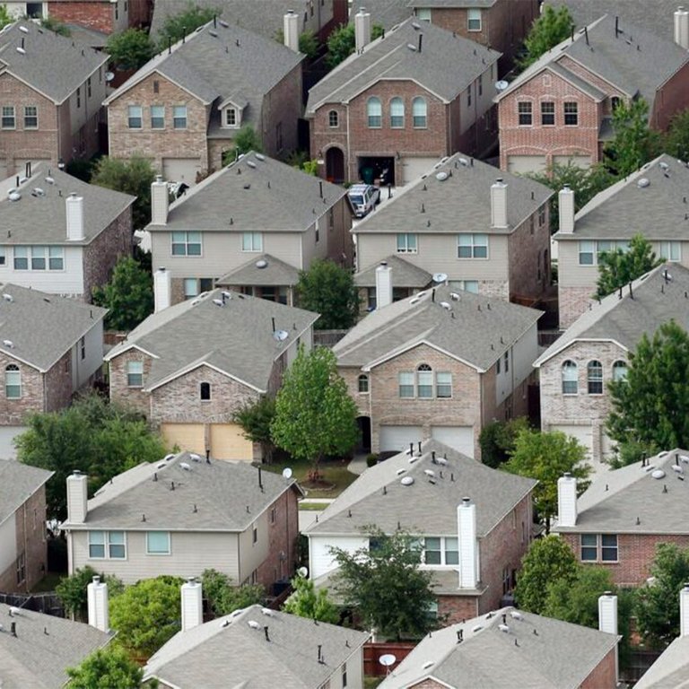 Uniform rows of houses with striking similarity.