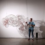 A CCA Furniture student installing her work in a gallery.