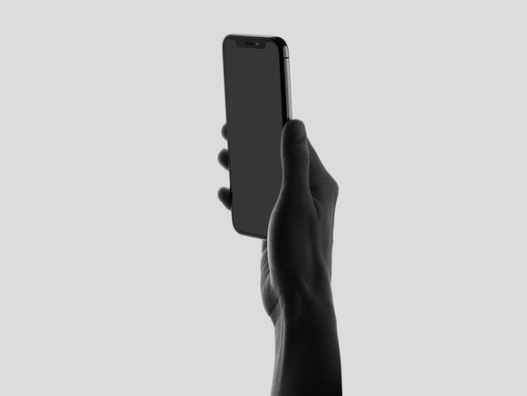 Image of hand holding a cell phone.