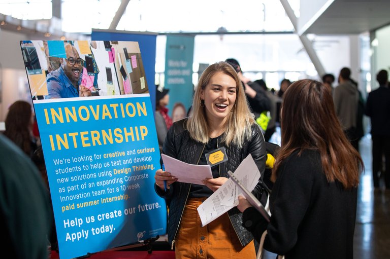 Student connecting with industry partners at the Career Day on campus.