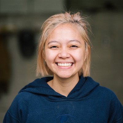 A young woman smiles for a photo.