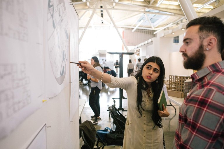Graduate students during the MArch Critique.