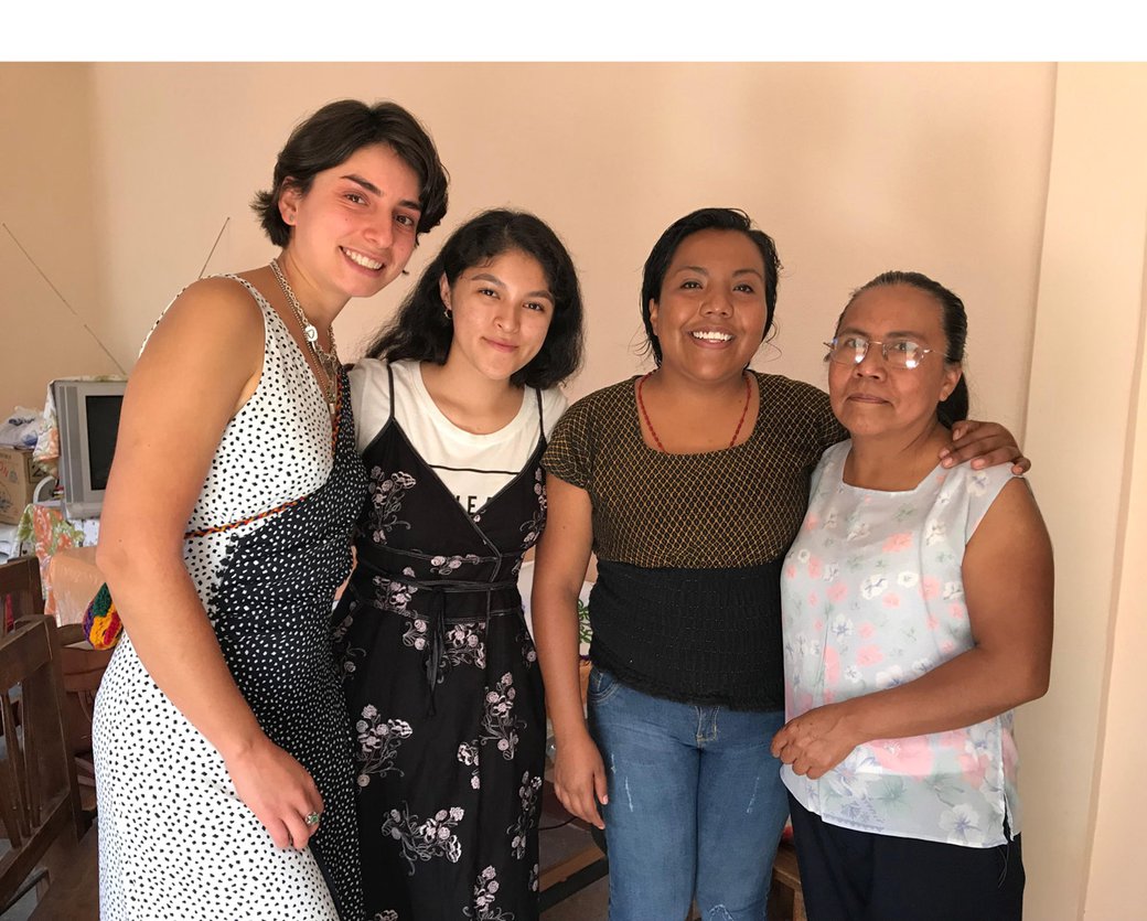 CCA students Yesenia Villaseñor and Sajida Silva pose with Oliva and her daughter Veronica