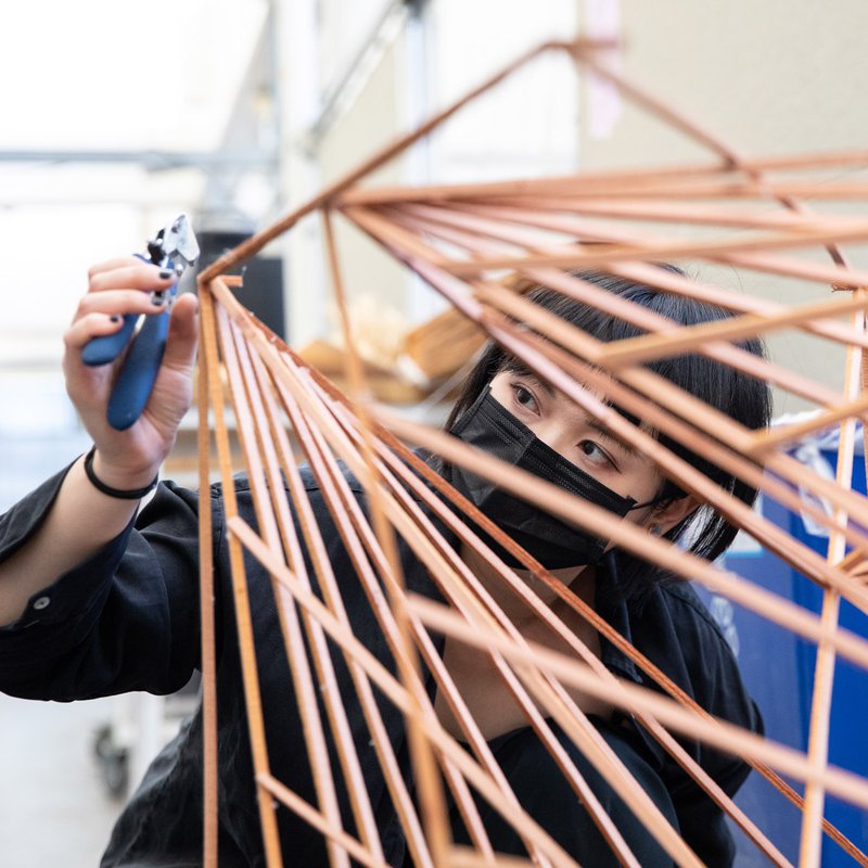 Architecture student working on her model in the studio.