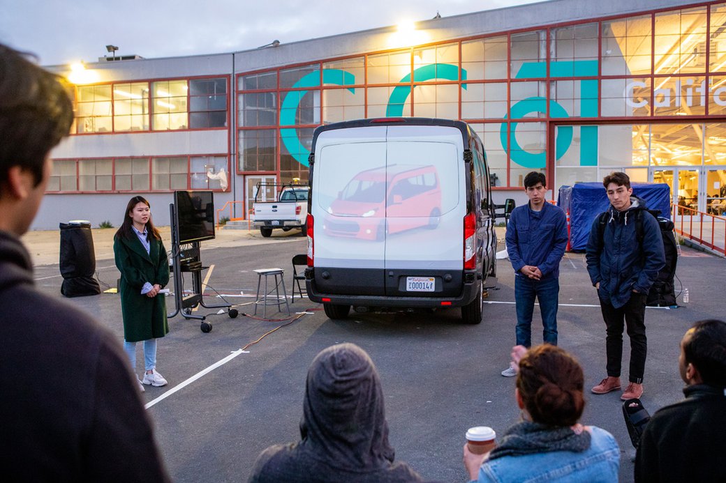 Students presenting their autonomous vehicle projects to Ford partners