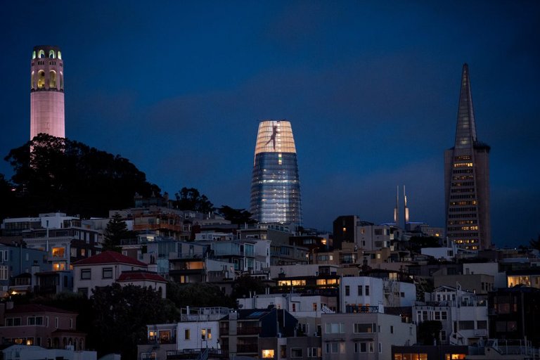 Figures dance across the crown of Salesforce Tower in San Francisco, as part of a light installation by artist Jim Campbell that premiered in May 2018.