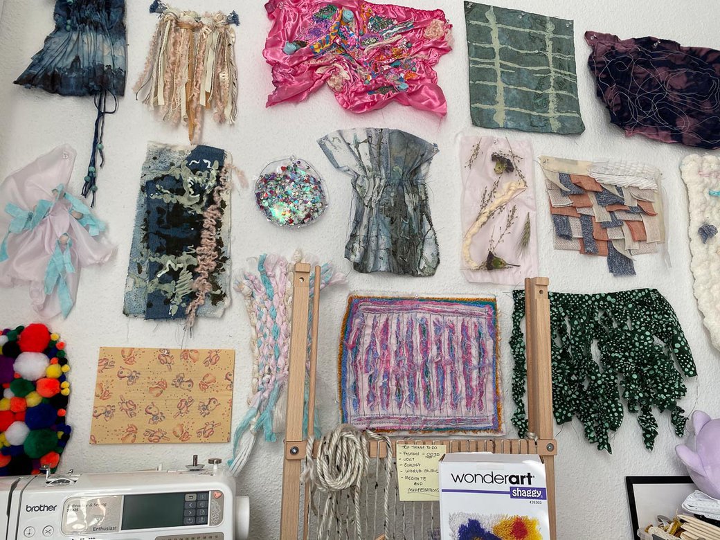 A wall of textile samples in various textures, colors, shapes, and designs.