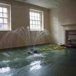 Abbas Akhavan, Study for a Garden: Fountain (installation view, Delfina Foundation, London), 2012. Oscillating water sprinkler, pump, hose, pvc pond liner, water, dimensions variable. Courtesy of Catriona Jeffries, Vancouver. Photo: Christa Holka.