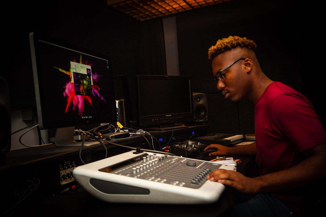 BFA Film student works on audio and sound correction in post-production film studio