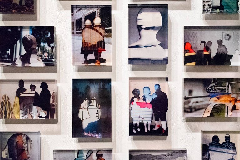 Diversity studies faculty artwork is featured on a wall.