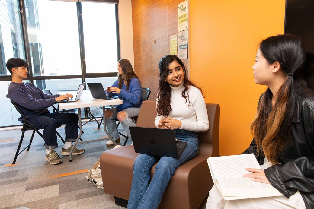 Students collaborating in the Blattner Hall's community spaces.