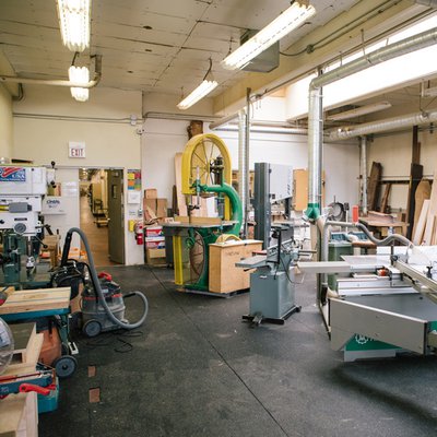 A view into the Furniture studio's machine room with woodworking equipment.