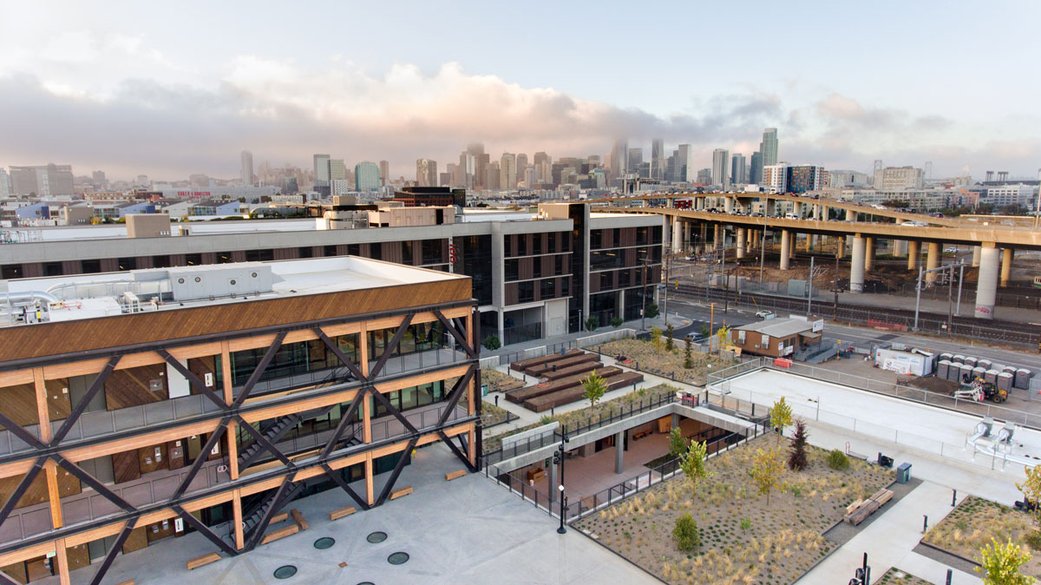 A drone shot of the new building overlooking the city.