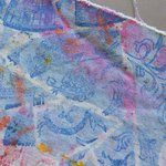 Close-up image of a multi-color print on muslin fabric