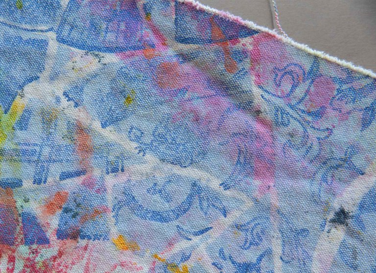 Close-up image of a multi-color print on muslin fabric