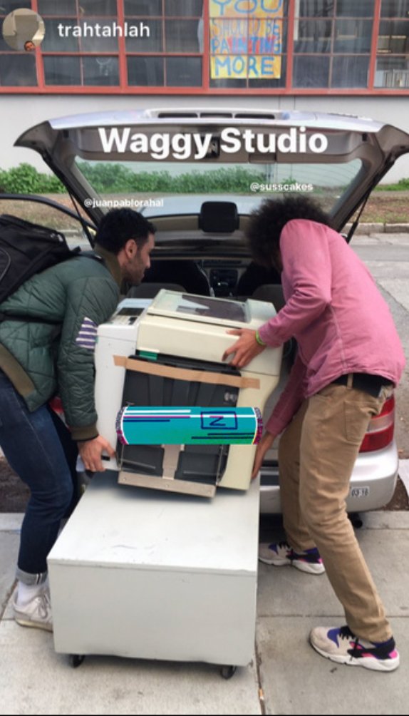 Juan Pablo and Negash moving the Risograph machine