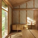 Interior view of a wooden A-frame cabin room with exposed timber beams and rafters, textured wallpaper with a scalloped pattern on the walls.