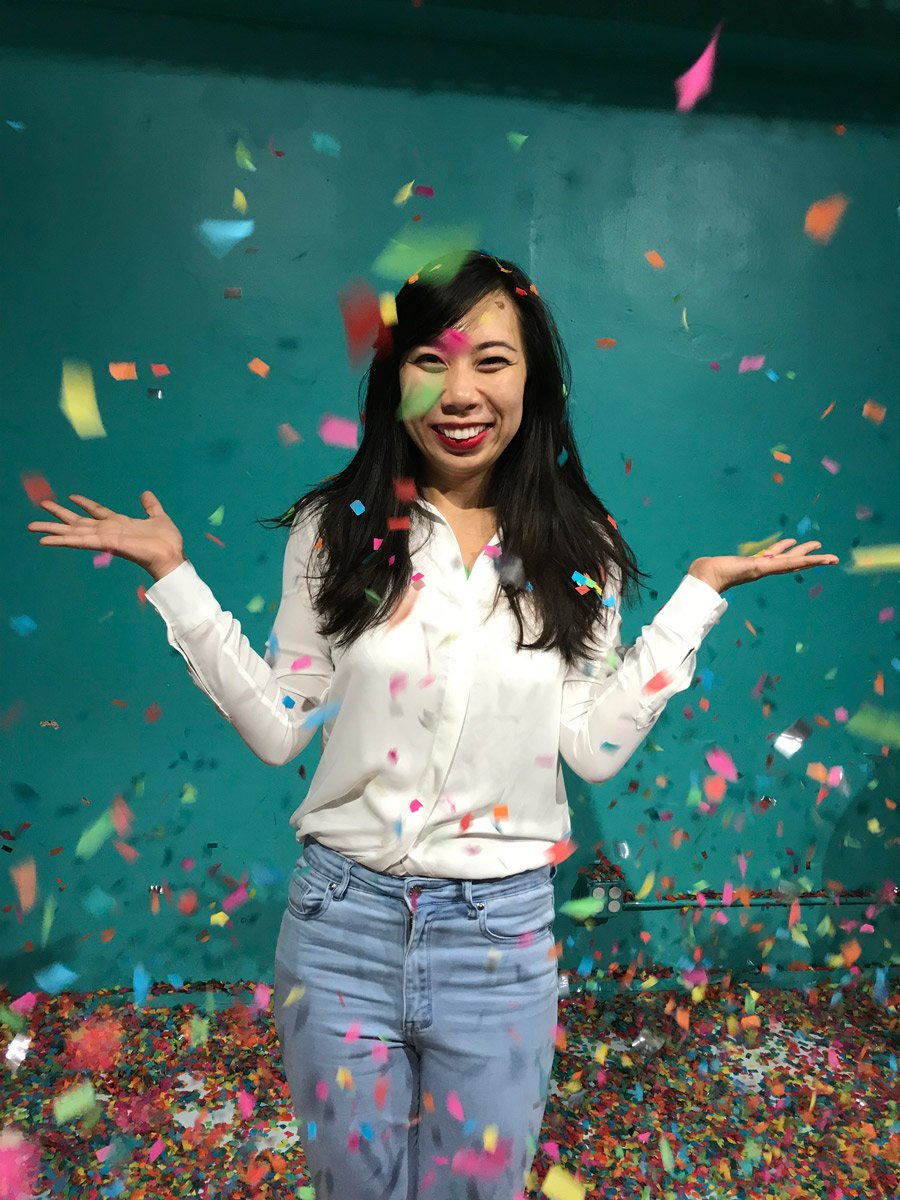Portrait of Kristine Yuen in confetti.
