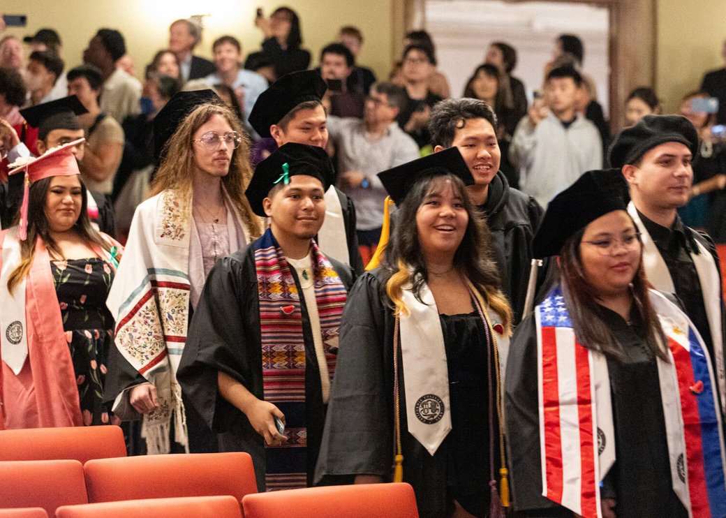 Undergraduate students enter the theater to participate in CCA's Commencement Ceremony.