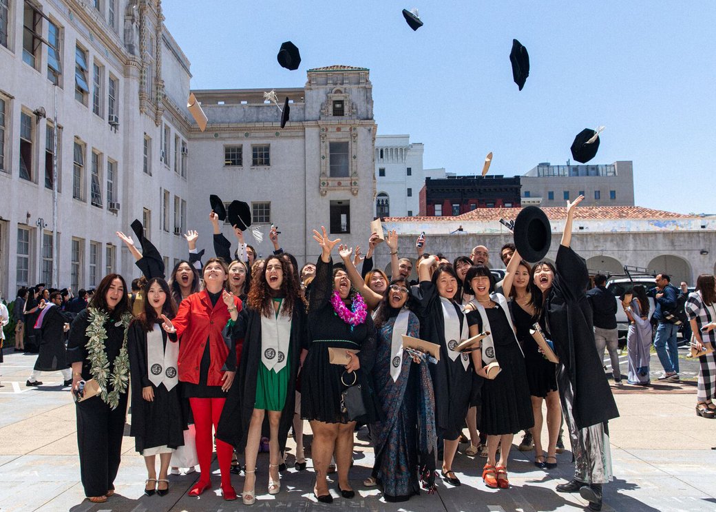Graduate students outside the theater before CCA's Commencement Ceremony.