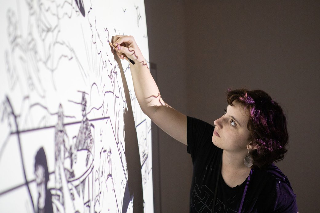 Pre-college program student working on drawing