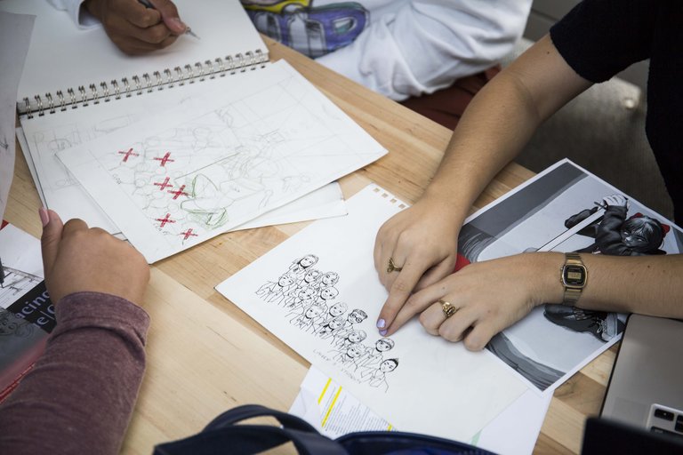 Students discussing illustration work