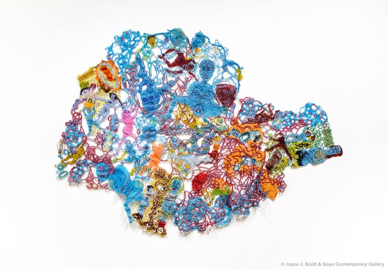 Joyce J. Scott, Baby Blue Book Redux, 2018. Beads, thread, 37 1/2 x 52 1/4 inches. Courtesy Goya Contemporary Gallery, Baltimore