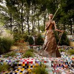 Joyce J. Scott, “Araminta With Rifle And Vèvè” (2017), painted milled foam with found objects and milled foam rifle with blown glass and mixed media appliqués, beaded staff, dimensions variable (image courtesy Goya Contemporary Gallery, Baltimore, MD, pho