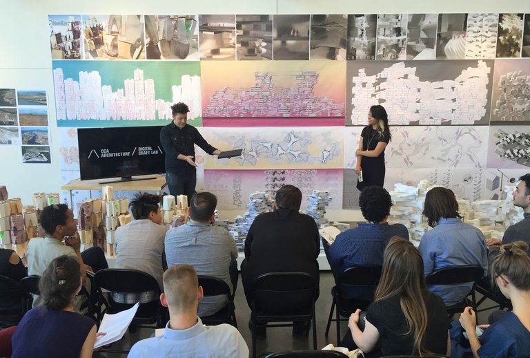 A man and women present to an audience