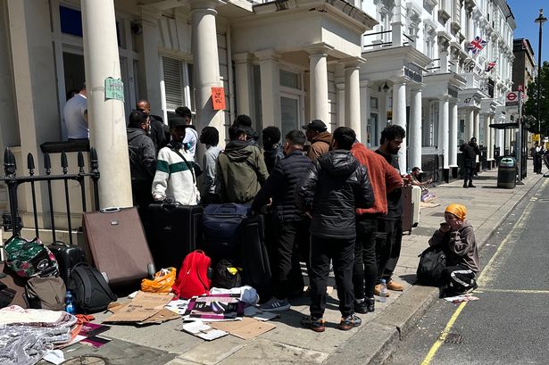Refugees protest outside London hotel due to being 'cramped' but are told they'll be 'homeless'