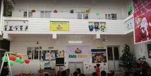 KIDS NEST Play School logo