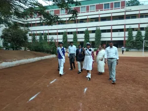 Vidya Vardhaka School logo