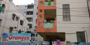 Oranges Play School logo