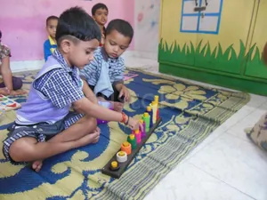 PERIWINKLE  PRE SCHOOL AND DAYCARE logo