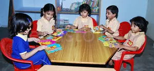 THE GENIUS PLAY SCHOOL logo