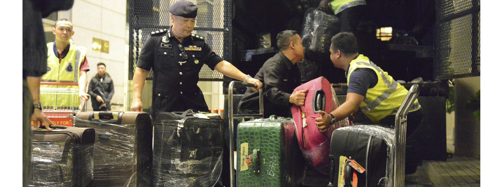 Cash filled suitcases seized from houses linked to former Malaysian PM