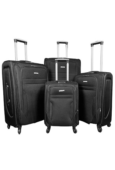Ensemble de quatre valises noires en nylon.