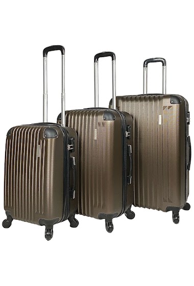 Ensemble de trois valises marrons extensibles en ABS renforcé.