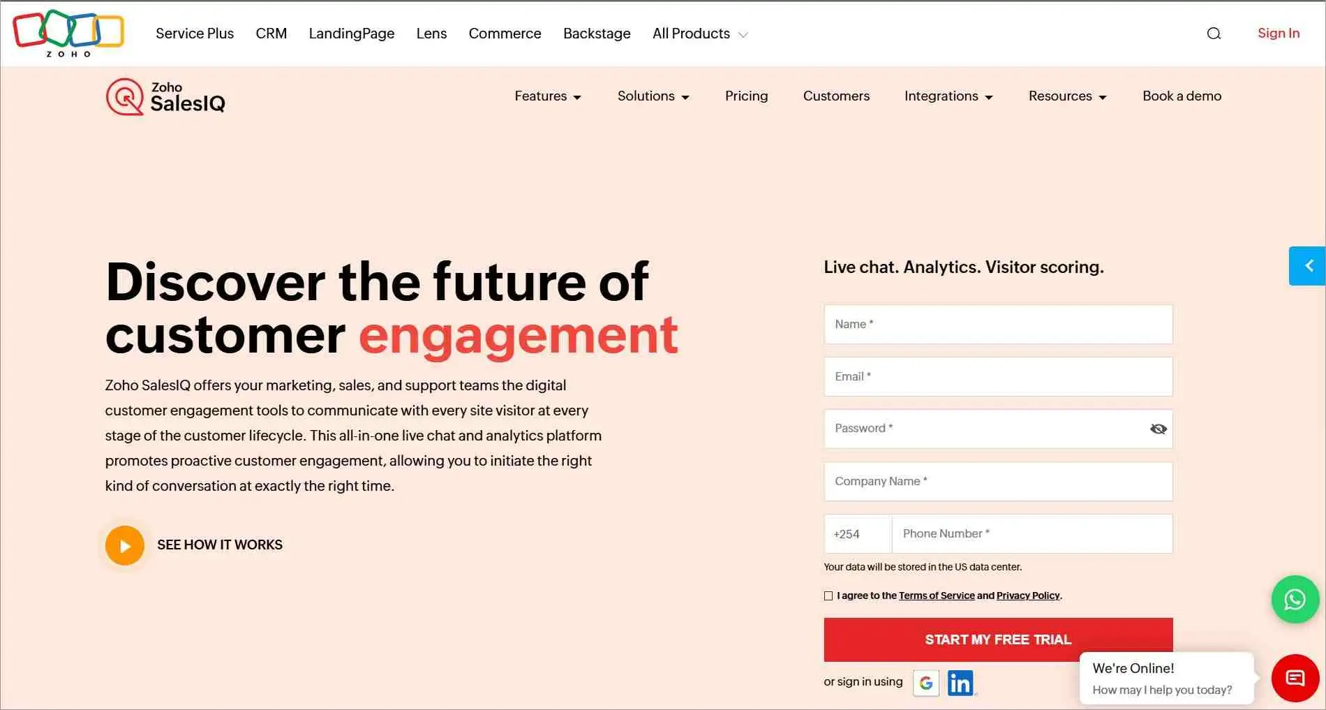 Zoho SalesIQ website highlighting live chat, analytics, visitor scoring, and a free trial registration form